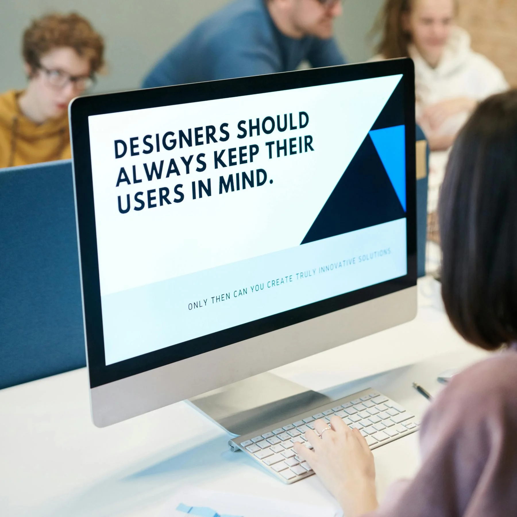 Designer reviewing Shopify storefront layout on desktop
