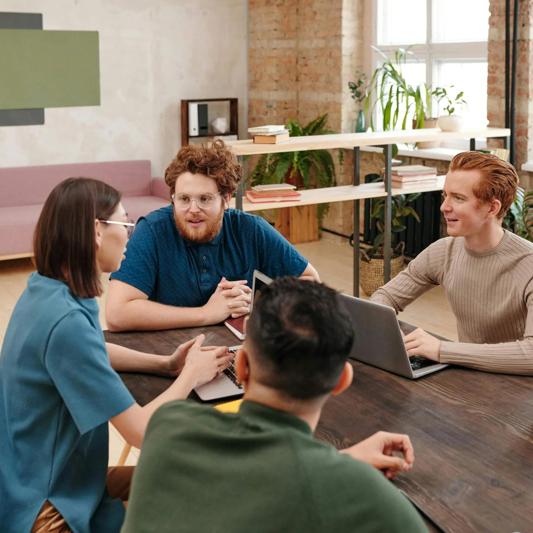 Team discussion during Shopify store planning meeting